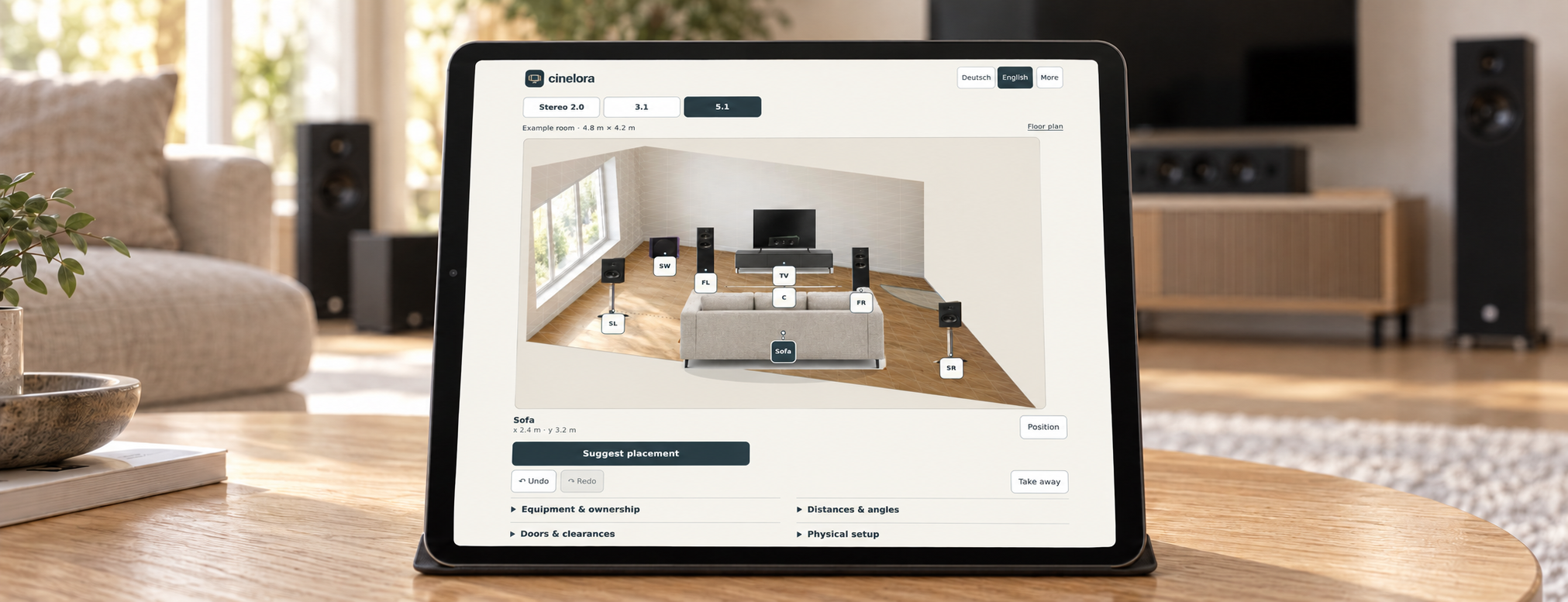 Cinelora home theater planner on a tablet in a living room